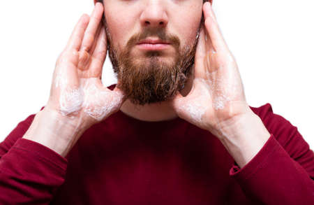 Man with beard soap or shampoo for refreshing the beard, Health beauty and skin care concept. clean and fresh isolated on white backgroundの写真素材