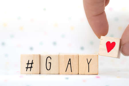 Wooden cubes with a hashtag and the word Gay, social media conceptの写真素材