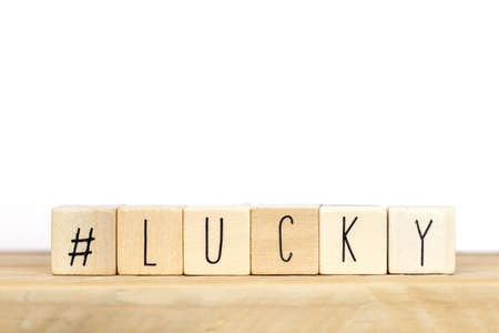 Wooden cubes with a hashtag and the word lucky background, social media conceptの写真素材