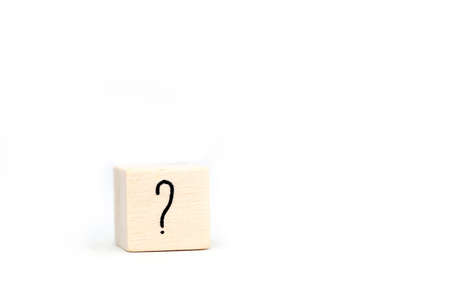 question mark on wood cube isolated on white background, symbol space for textの写真素材