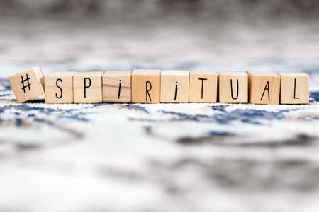 Wooden cubes with a hashtag and the word Spiritual, social media and spiritual concept backgroundの写真素材