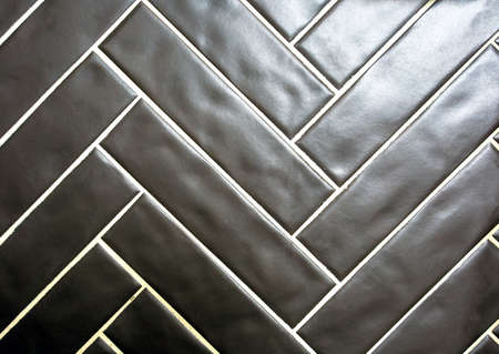 Modern shiny black tile surface background texture, modern retro design, close-up
