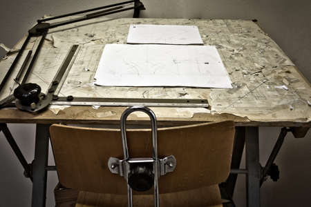 drawing table with blueprints, architect table, vintage, sketches close up with chair