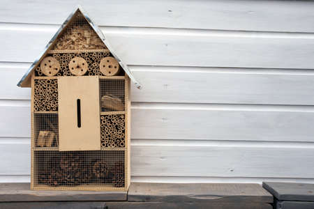 Craftsman built insect hotel decorative wood house with compartments and natural components refuge...