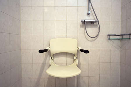 Shower seat wall mounted for disabled person or elderly, shower for handicapped or senior homeの写真素材