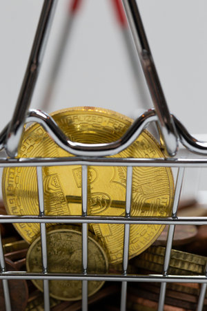 Gold Bitcoin is a cryptocurrency and worldwide payment, Bitcoin, Ethereum, Litecoin in iron shopping basket, Virtual money concept. business and financial conceptの写真素材