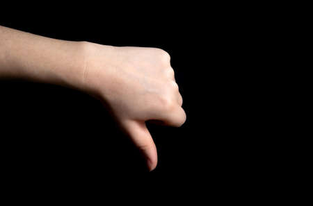 Thumb down sign hand gesture on dark black background, Review, business, sign, negative,bad concept