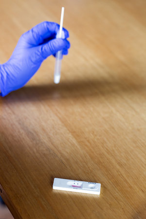 Senior woman studying and taking the self test for , home test kit for close-upの写真素材