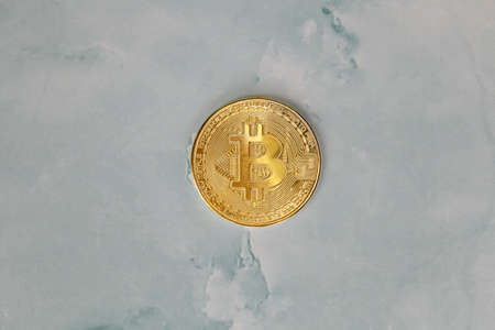 Golden Bitcoins Cryptocurrency top view stack of Digital coins on gray marble desk table background.Flat lay blank text.Copy space for word. concrete designの写真素材