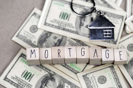Real Estate Mortgage Loan text With House Keys on money, property, financial, business concept backgroundの写真素材