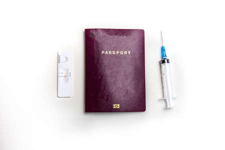 International biometric COVID-19 vaccination passport, syringe and Covid-19 negative test, traveling in pandemic worlwide concept on white background top view, copy spaceの写真素材