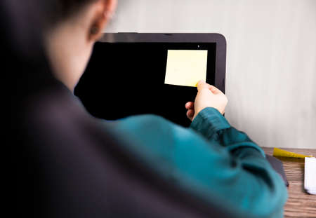 Business woman work from home with blank sticky post on computer for reminder business, home office...
