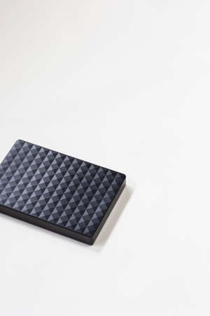 External hard disk drive isolated on white background, modern design for storage computer, laptop. Copy space,top viewの写真素材