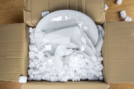 Young woman unwrapping delivery package online shopping package.