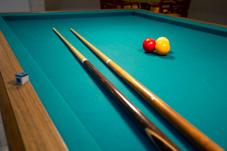 A green cloth billiards or pool table red,yellow and white ball,hobby and sport with copy spaceの写真素材