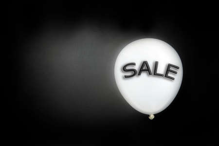 Black Friday concept. Quote Black Friday on black balloon. Flat lay, top view. Black Friday background with copy space and text SALEの写真素材