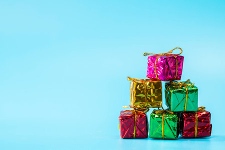 Christmas gift boxes on stylish blue background with copy space, retro modern design, Holiday,presents conceptの写真素材