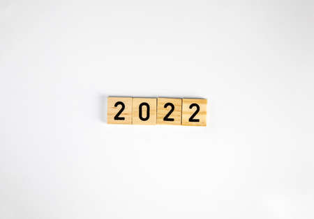 woodblocks cubes with a number 2022 in white isolated background with copy space. image banner size. new year 2022 concept.の写真素材