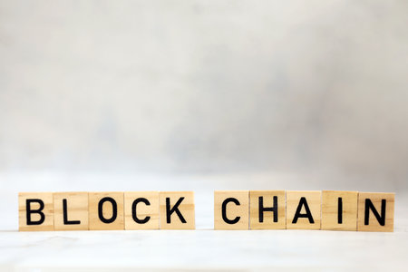 Blockchain text on wooden cubes, cryptocurrency,technology binary code, ditigal data and secure...