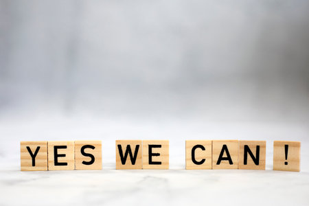 Yes we can text wooden cubes . Positive thinking, motivation, attitude and confidence concept. bright background texture with copy space self believe team workの写真素材