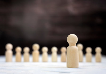 Team leader mockup, copy space. Leadership, winning, boss. Winner and defeated. Wooden figure on cube,leading a business team group of people concept space for textの写真素材