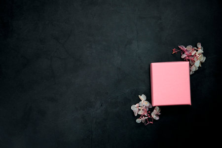 Pink open or closed gift box on a gray concrete background. Top view. copy-space. present,Birthday,Mothers Day,Valentines Day concept space for textの写真素材
