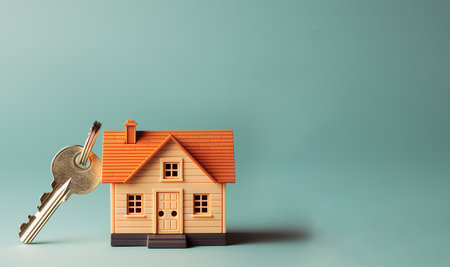 Miniature house and key. Concept for Mortgage, Rent or buy a house, real estate, investment, property concept space for textの素材