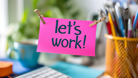Sticky note in office room or work place with the text Let's work text on a sticky, pen, Desk with business decoration. Brainstorming motivation concept Copy spaceの素材
