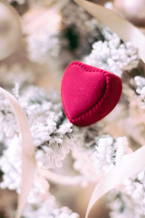 Red heart shaped jewellery box, a perfect holiday love surprise for her on Christmasの写真素材