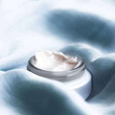 luxury face cream on soft silk - anti-aging, cosmetic and beauty styled conceptの写真素材