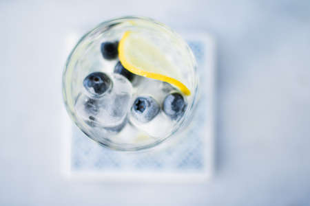 drinks, cocktails and celebration styled concept - cocktail with blueberry ice and lemon, elegant visualsの写真素材