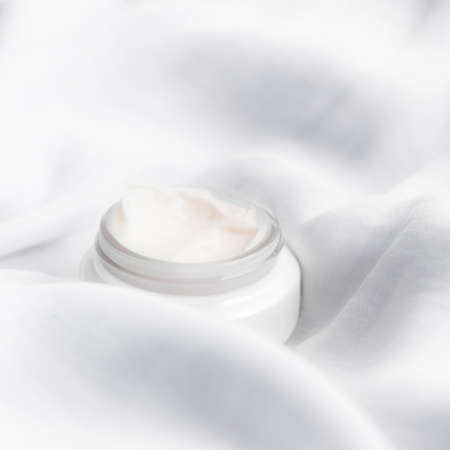 luxury face cream on soft silk - anti-aging, cosmetic and beauty styled concept, elegant visuals