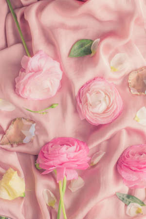 pink rose flowers on soft silk - wedding, holiday and floral background styled concept, elegant visualsの写真素材