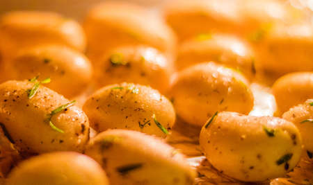 rustic food and homemade cooking styled concept - roasted potatoes in the oven recipe, elegant...