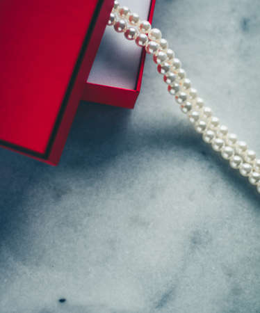 wonderful pearls in a red gift box, luxe present - jewellery and luxury gift for her styled concept, elegant visualsの写真素材