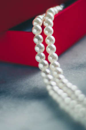 wonderful pearls in a red gift box, luxe present - jewellery and luxury gift for her styled concept,...