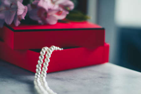 wonderful pearls in a red gift box, luxe present - jewellery and luxury gift for her styled concept, elegant visualsの写真素材