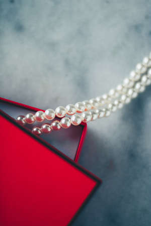 wonderful pearls in a red gift box, luxe present - jewellery and luxury gift for her styled concept,...