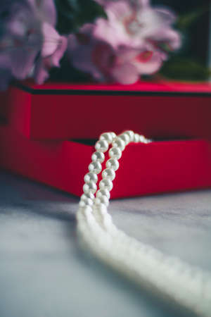wonderful pearls in a red gift box, luxe present - jewellery and luxury gift for her styled concept, elegant visualsの写真素材