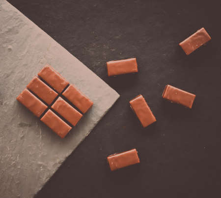 Sweet swiss chocolate candies on a stone tabletop, flatlay - desserts, confectionery and gluten-free organic food concept.  All you need is chocolateの写真素材