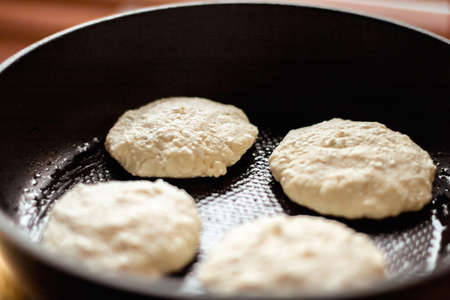 Pancakes on frying pan, rustic cookbook recipe - weekend cooking, food blog and homemade cuisine concept. Making your favorite pancakesの写真素材