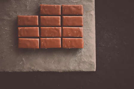 Sweet swiss chocolate candies on a stone tabletop, flatlay - desserts, confectionery and gluten-free...