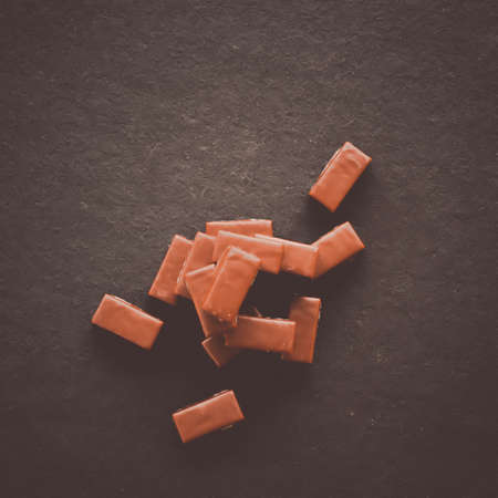 Sweet swiss chocolate candies on a stone tabletop, flatlay - desserts, confectionery and gluten-free...