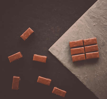 Sweet swiss chocolate candies on a stone tabletop, flatlay - desserts, confectionery and gluten-free organic food concept.  All you need is chocolateの写真素材