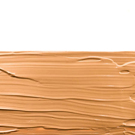Make-up base foundation brush strokes, flatlay - cosmetic products, beauty texture background...