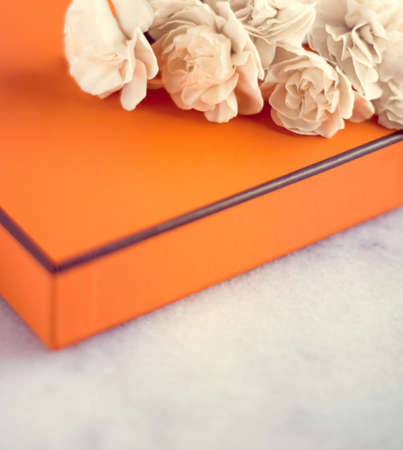 Present box and flowers for her - Mother's day ideas, happy giving and holiday inspiration concept. The perfect gift for momの写真素材