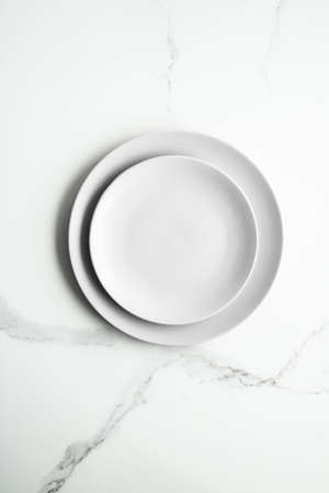 White empty plate on marble, flatlay - stylish tableware, romantic table decor and food menu...