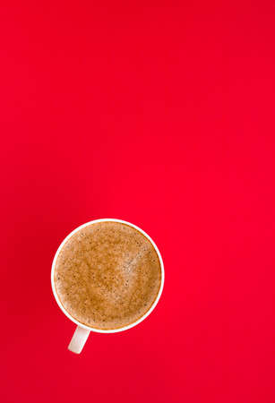 Breakfast, drinks and modern lifestyle concept - Hot aromatic coffee on red background, flatlayの写真素材