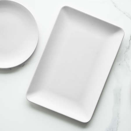 White empty plate on marble, flatlay - stylish tableware, romantic table decor and food menu concept. Serve the perfect dishの写真素材