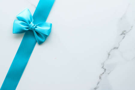 Holiday decor, feminine design and flatlay concept - Blue silk ribbon on marble, top viewの写真素材